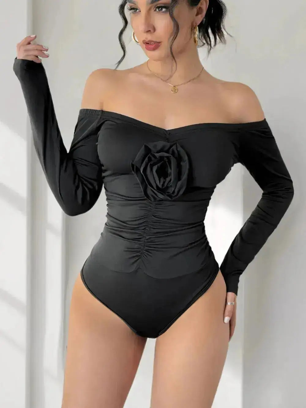 Perfee Ruched Flower Off-Shoulder Long Sleeve Bodysuit by Parfymia